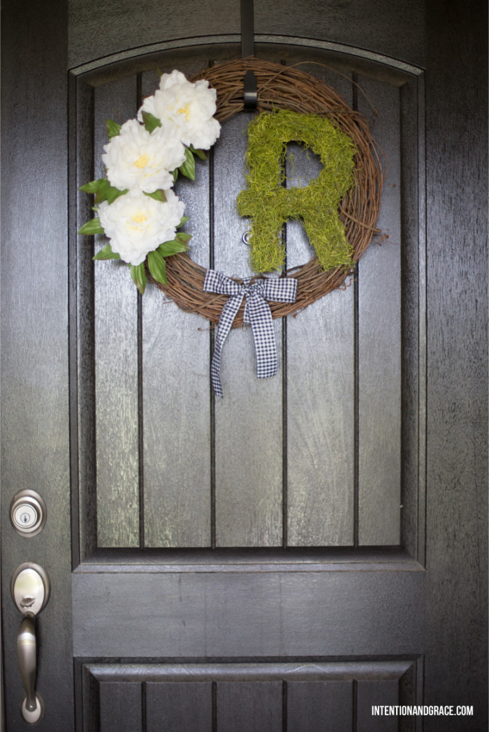 This initial wreath was so easy to make and only cost me $12. Make your door pop with this simple front door DIY  |  Intentionandgrace.com 